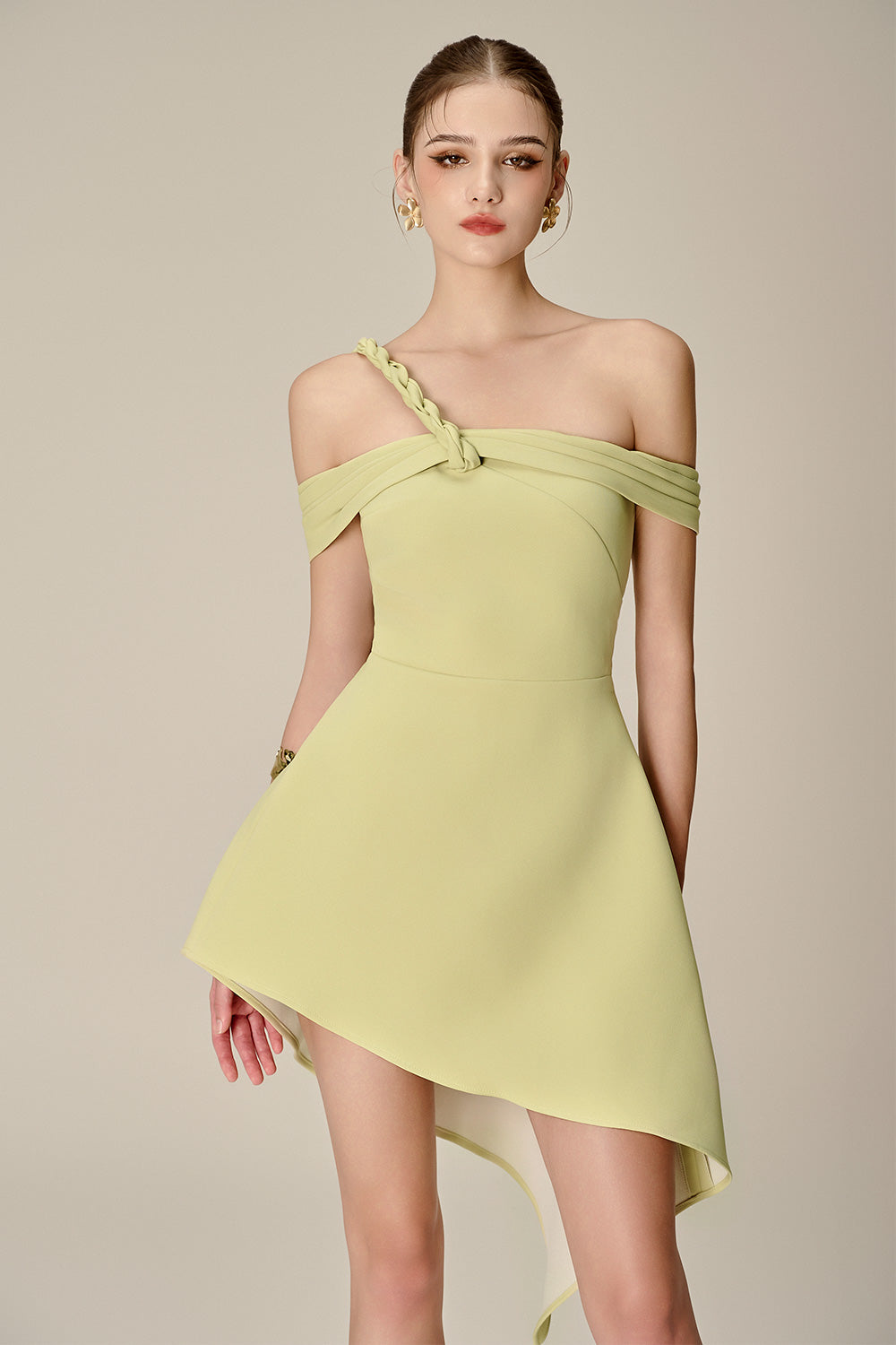 ANILA ASYMMETRIC OFF-SHOULDER MINI DRESS IN NUGGETS GREEN