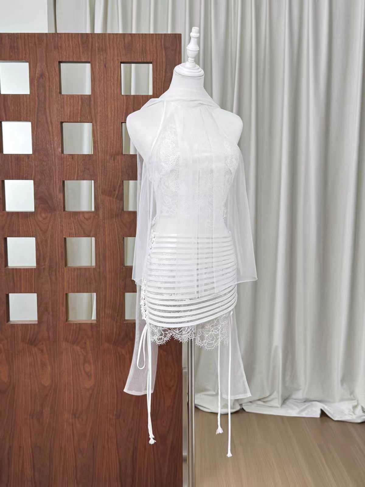 20260708160832_267_34 WHITE HALTER SHEER MESH LACE TOP & SIDE TIE BANDAGE MINI SKIRT SET