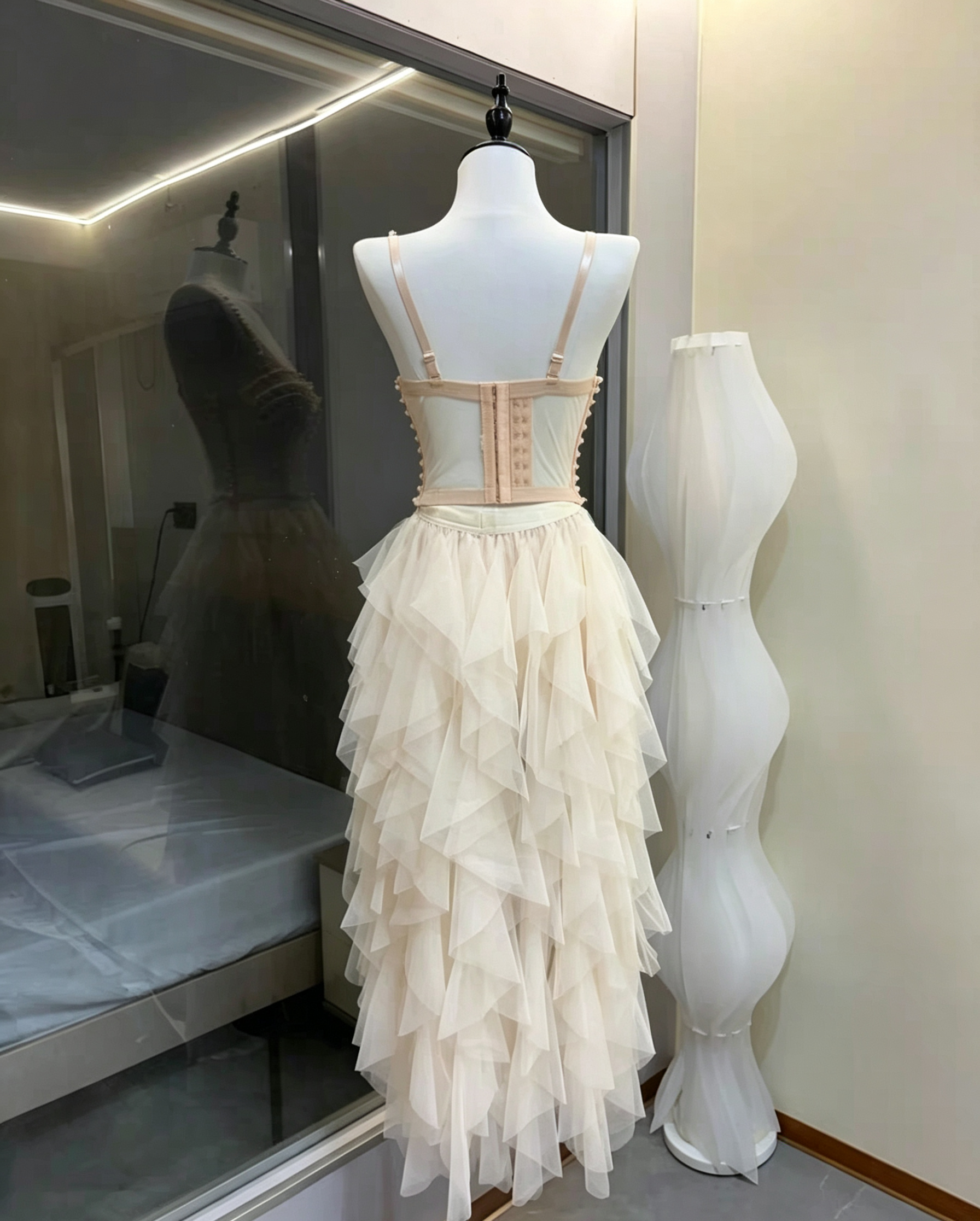 6_dbd9e75c-30bc-438b-93c6-00989d92a3f0 CREAM STRAPLESS PEARL CORSET TOP & HIGH-LOW RUFFLE TULLE SKIRT SET