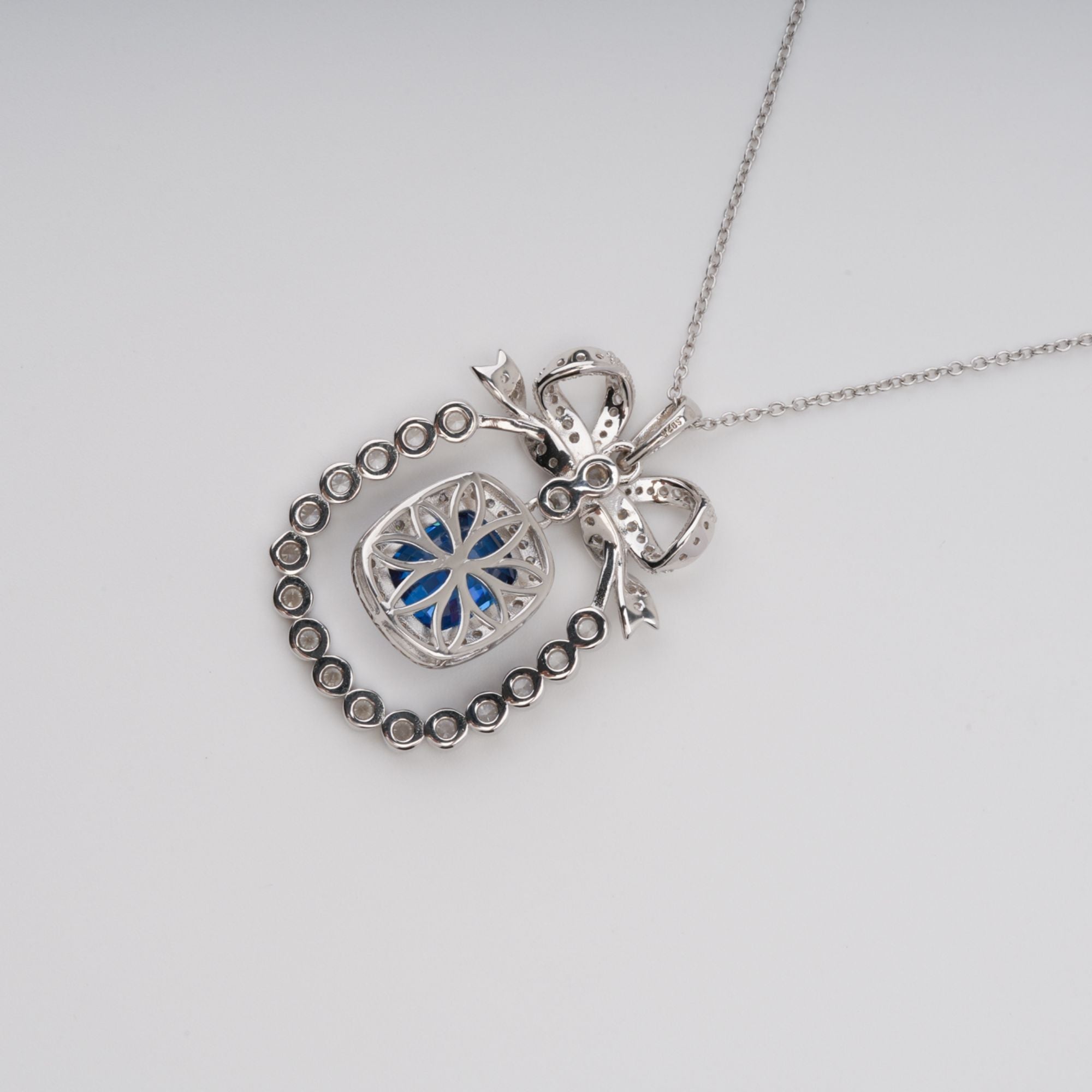 DSC07112_5db91e2b-f3aa-456e-8a84-27dff0547026 KAISU BLUE BOW PENDANT NECKLACE, SILVER GEMSTONE