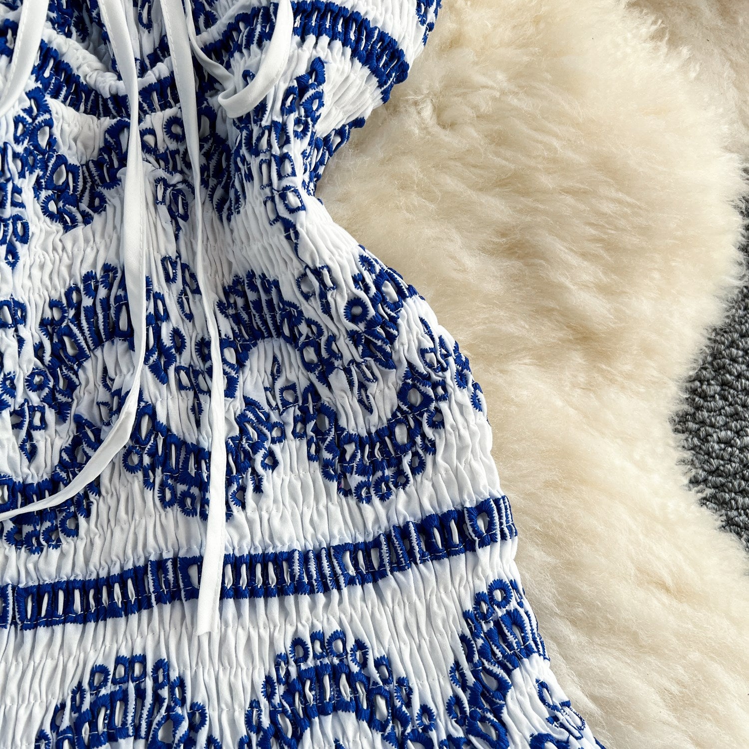O1CN01NiWLzf2IpwlY6oBte__2214341149336-0-cib WHITE FIT-AND-FLARE MINI DRESS WITH BLUE EMBROIDERY