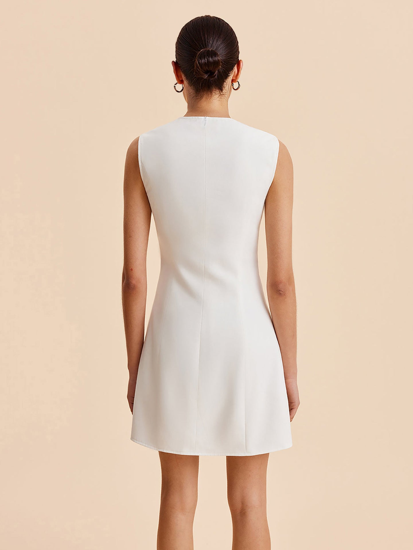 SLEEVELESS GOLD BUTTON WAVY HEM MINI DRESS