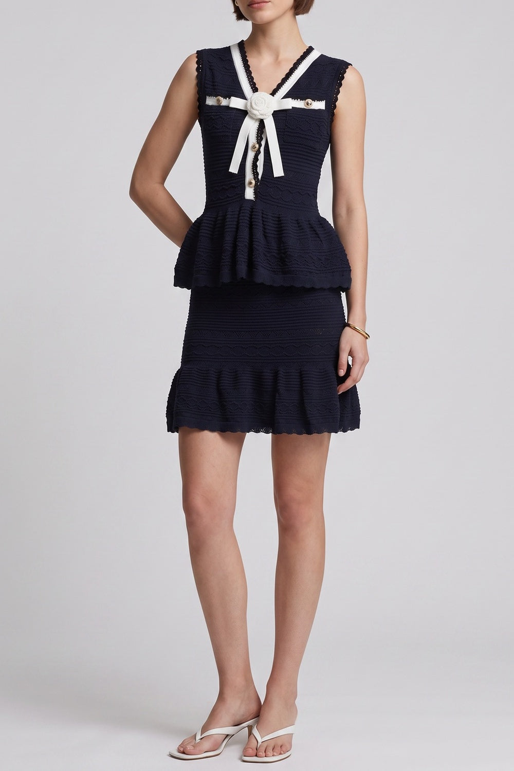 c0b482fe2a987d57 NAVY PEPLUM TOP & RUFFLE SKIRT 2PC SET